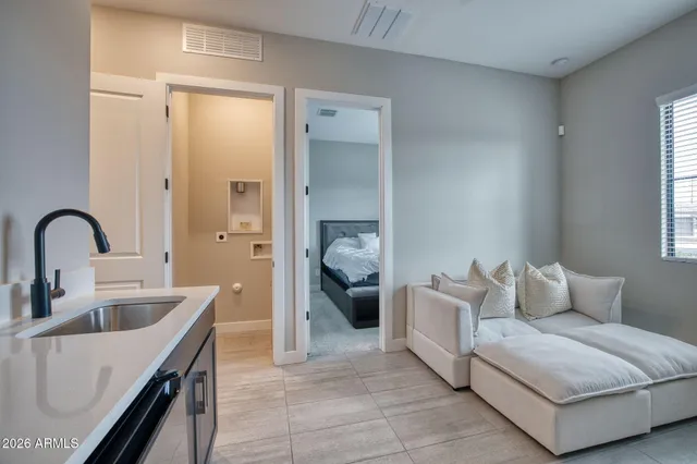 a living room with furniture and a gate