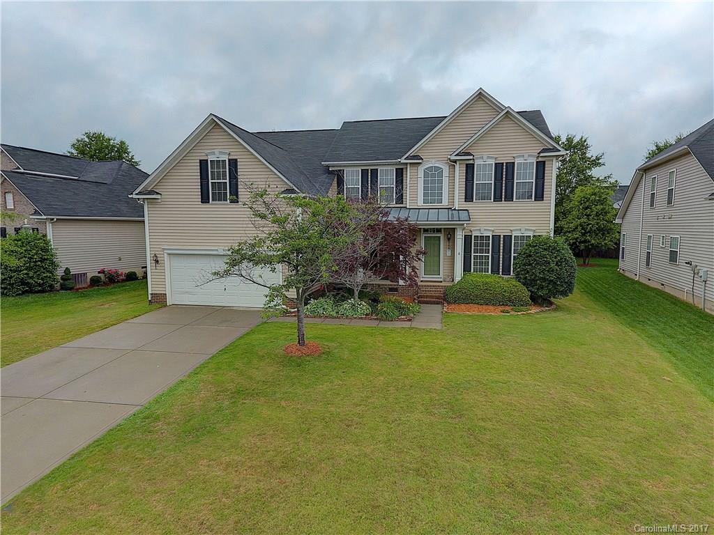 716 Beille Lane Fort Mill, SC 29708 - Photo 1 of 24 a front view of a house with garden