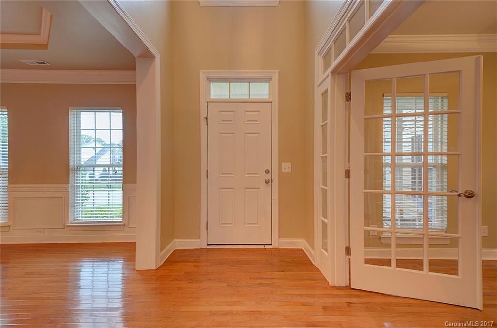 716 Beille Lane Fort Mill, SC 29708 - Photo 2 of 24 an empty room with wooden floor and windows