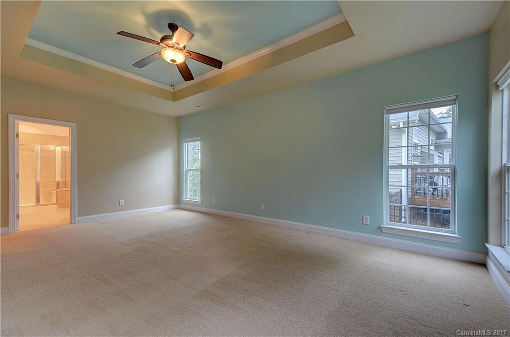 716 Beille Lane Fort Mill, SC 29708 - Photo 13 of 24 an empty room with windows and ceiling fan
