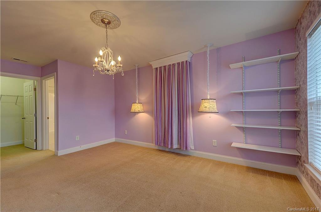 716 Beille Lane Fort Mill, SC 29708 - Photo 19 of 24 a view of a room with toys and a chandelier fan