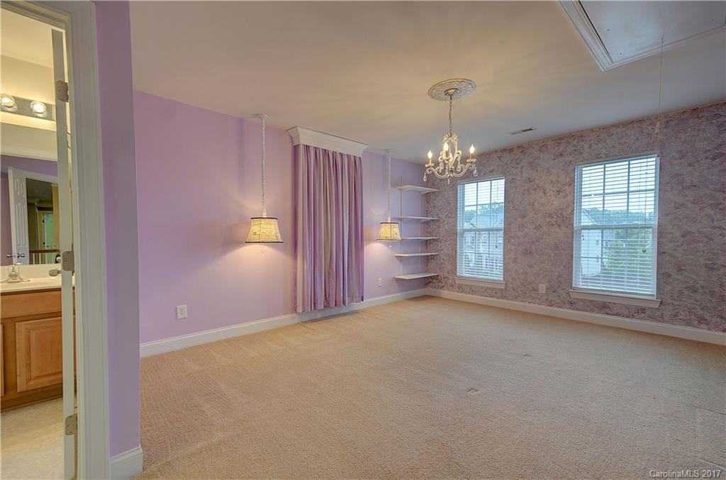 716 Beille Lane Fort Mill, SC 29708 - Photo 20 of 24 a view of a room with windows and chandelier