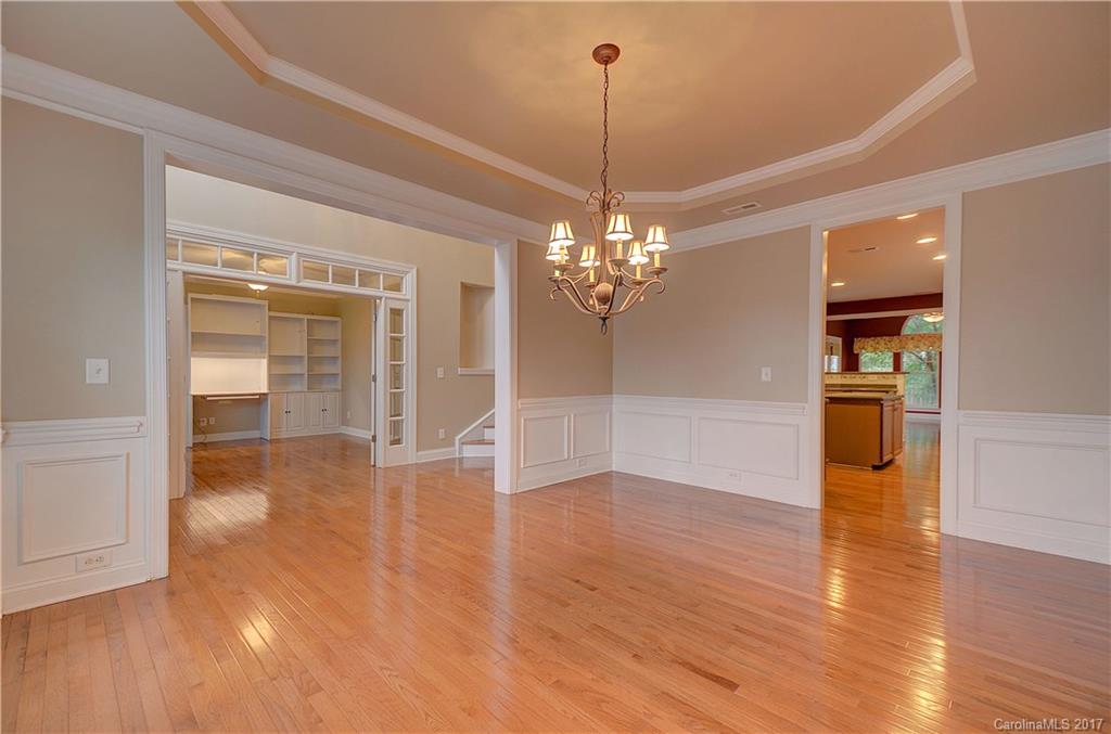 716 Beille Lane Fort Mill, SC 29708 - Photo 5 of 24 a view of a room with wooden floor chandelier and windows