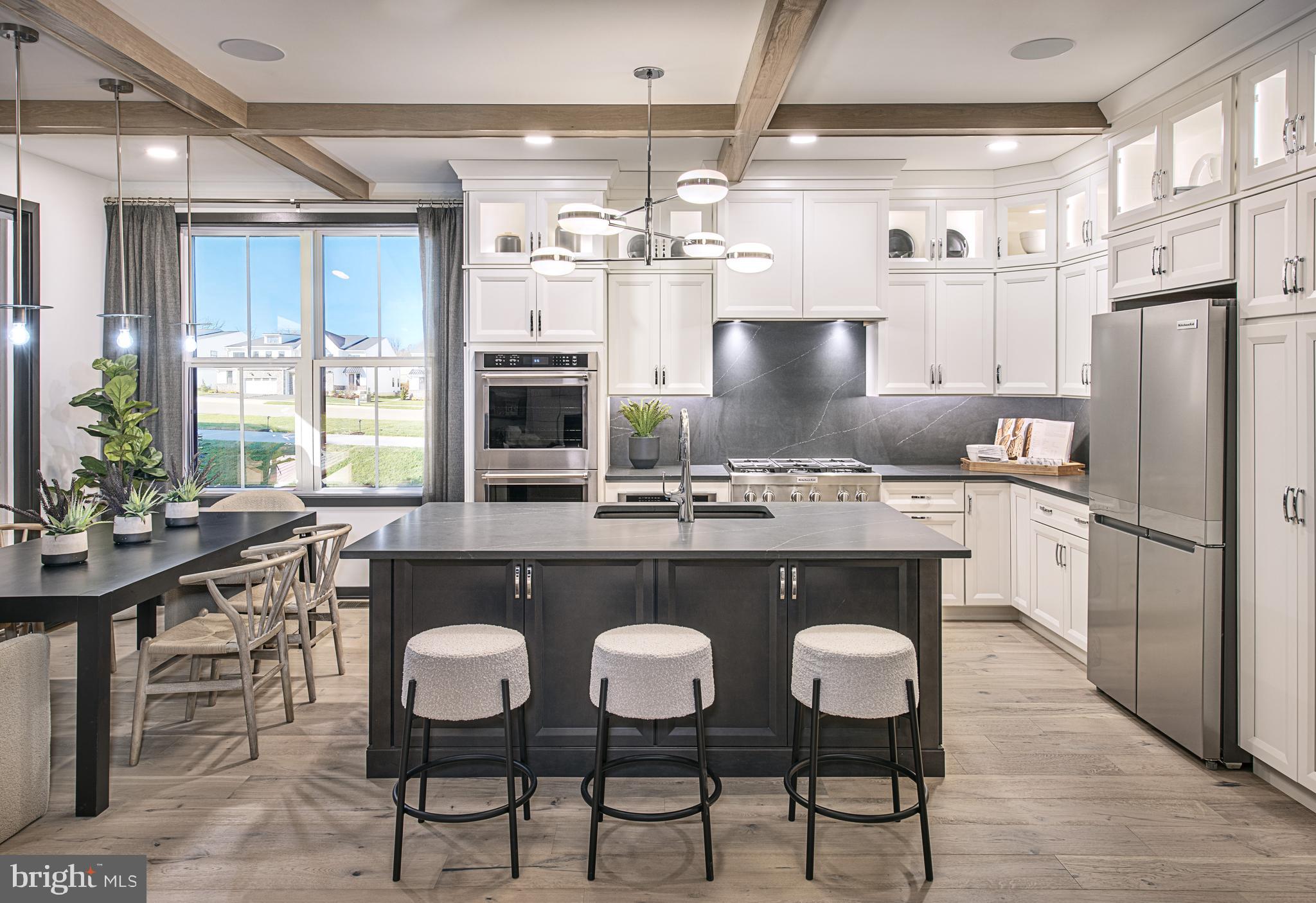 0 The Willis Elite Malvern, PA 19355 - Photo 1 of 19 a kitchen with stainless steel appliances granite countertop a table chairs stove and refrigerator