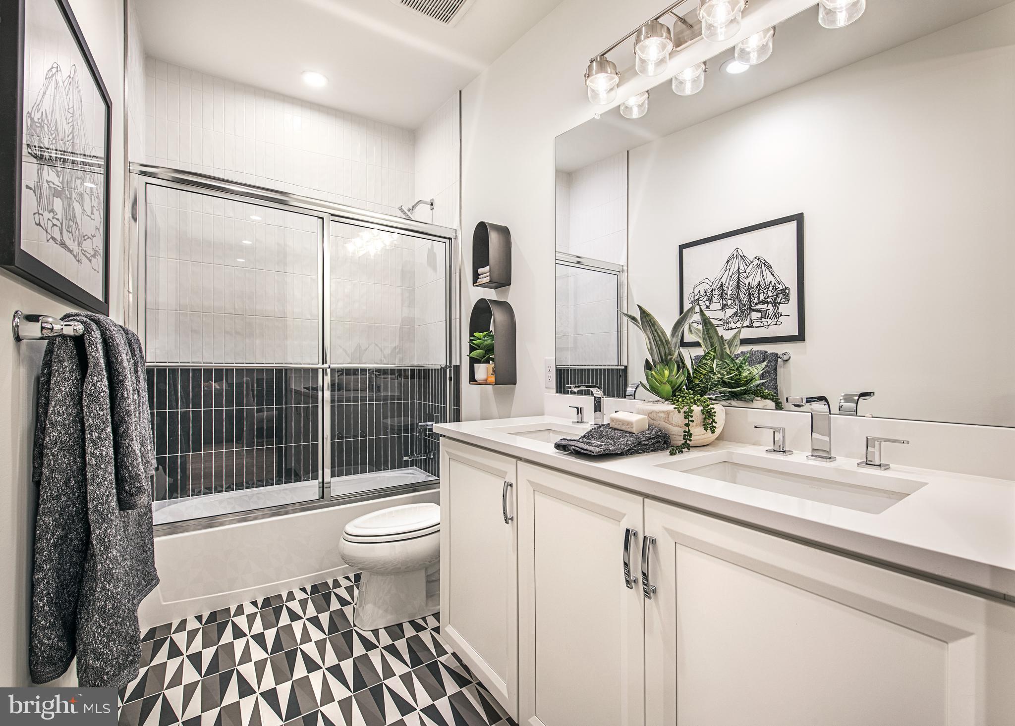 0 The Willis Elite Malvern, PA 19355 - Photo 12 of 19 a bathroom with a sink a toilet a mirror and shower