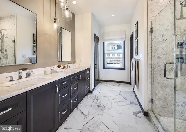 a spacious bathroom with a double vanity sink shower and mirror