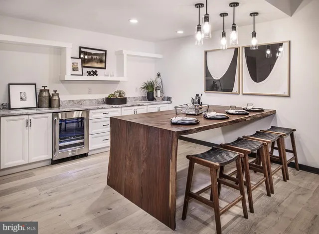 a kitchen with a sink cabinets and stainless steel appliances