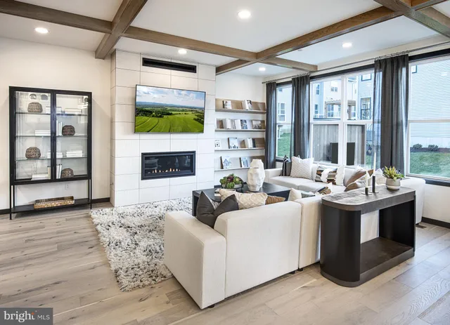 a living room with fireplace furniture and a flat screen tv