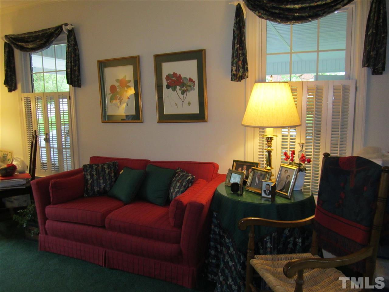 681 Manchester Drive Raleigh, NC 27609 - Photo 3 of 5 a living room with furniture and a lamp