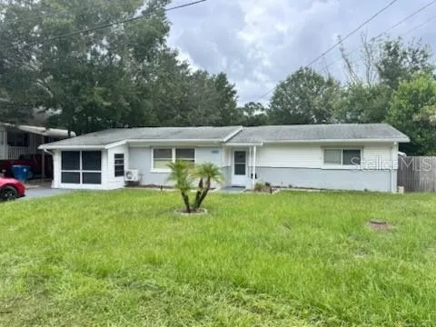 a view of a house with a backyard