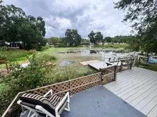 a view of a patio with two chairs and a table