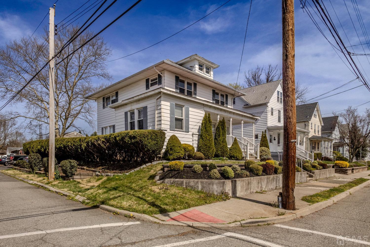 49 Riva Avenue, Unit 2 Milltown, NJ 08850 - Photo 3 of 22 a front view of a building with street