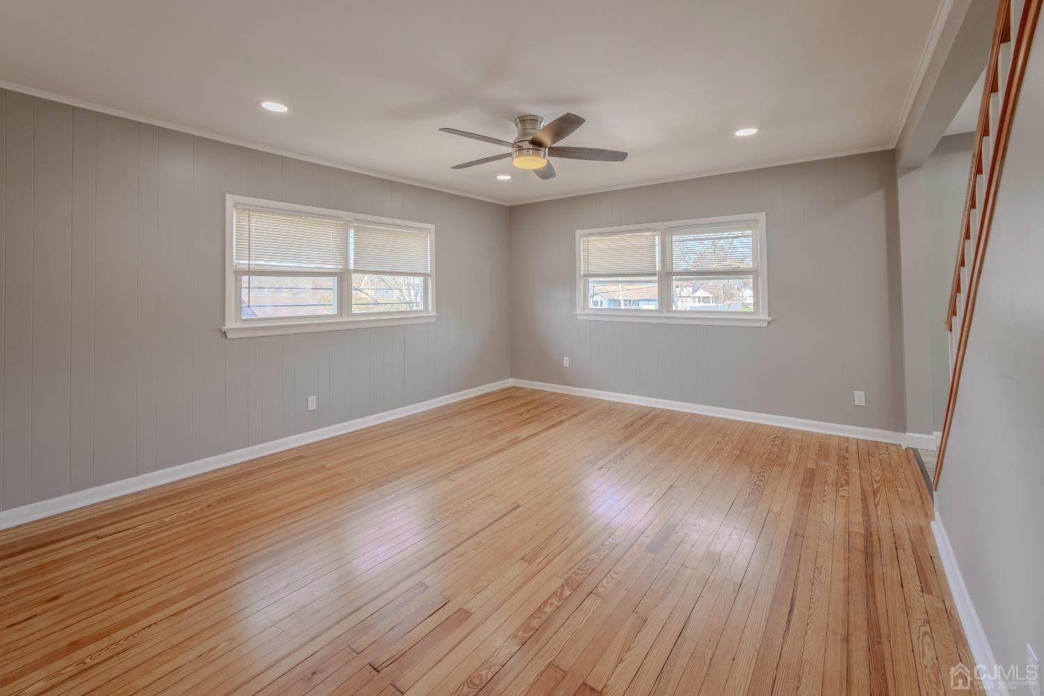 49 Riva Avenue, Unit 2 Milltown, NJ 08850 - Photo 10 of 22 a view of an empty room with wooden floor and a window