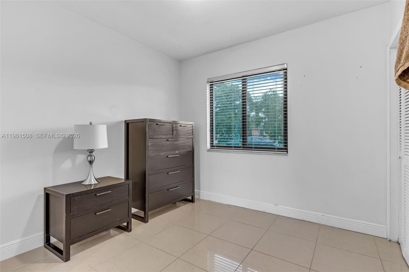 7585 Southwest 28th Street Miami, FL 33155 - Photo 14 of 28 a room with cabinets and bed
