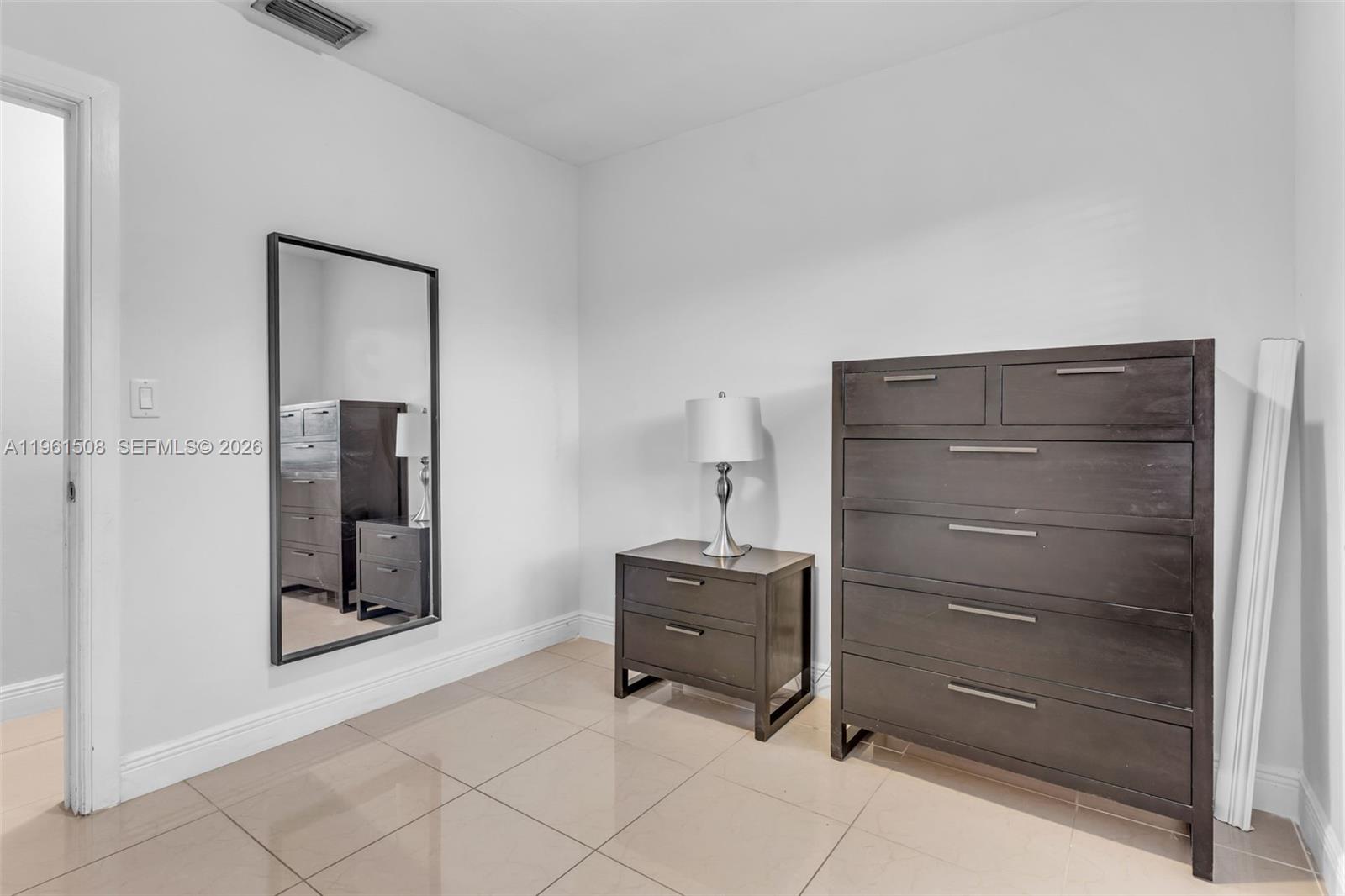 7585 Southwest 28th Street Miami, FL 33155 - Photo 15 of 28 a room with furniture and closet