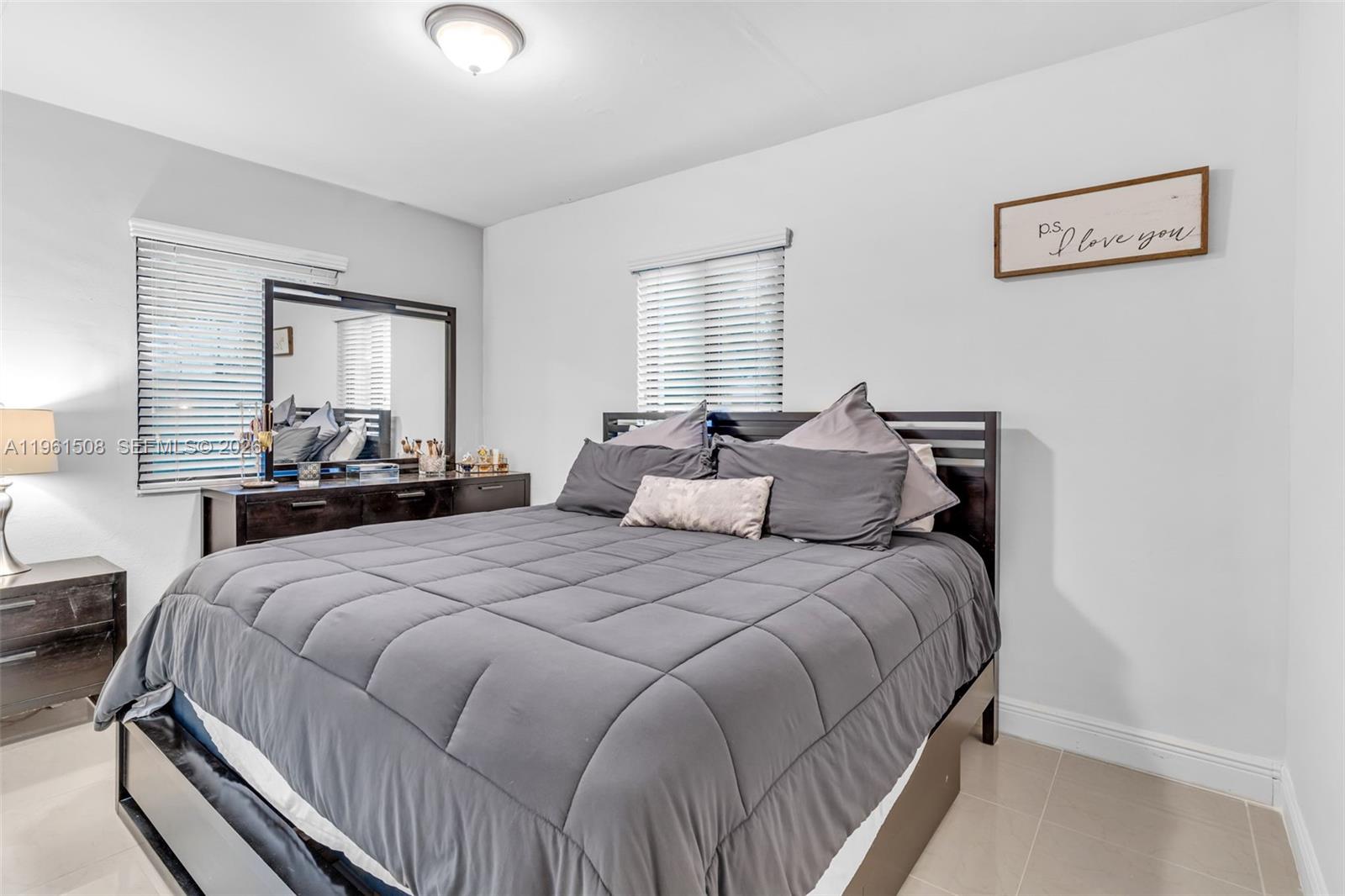 7585 Southwest 28th Street Miami, FL 33155 - Photo 16 of 28 a bedroom with bed and a window