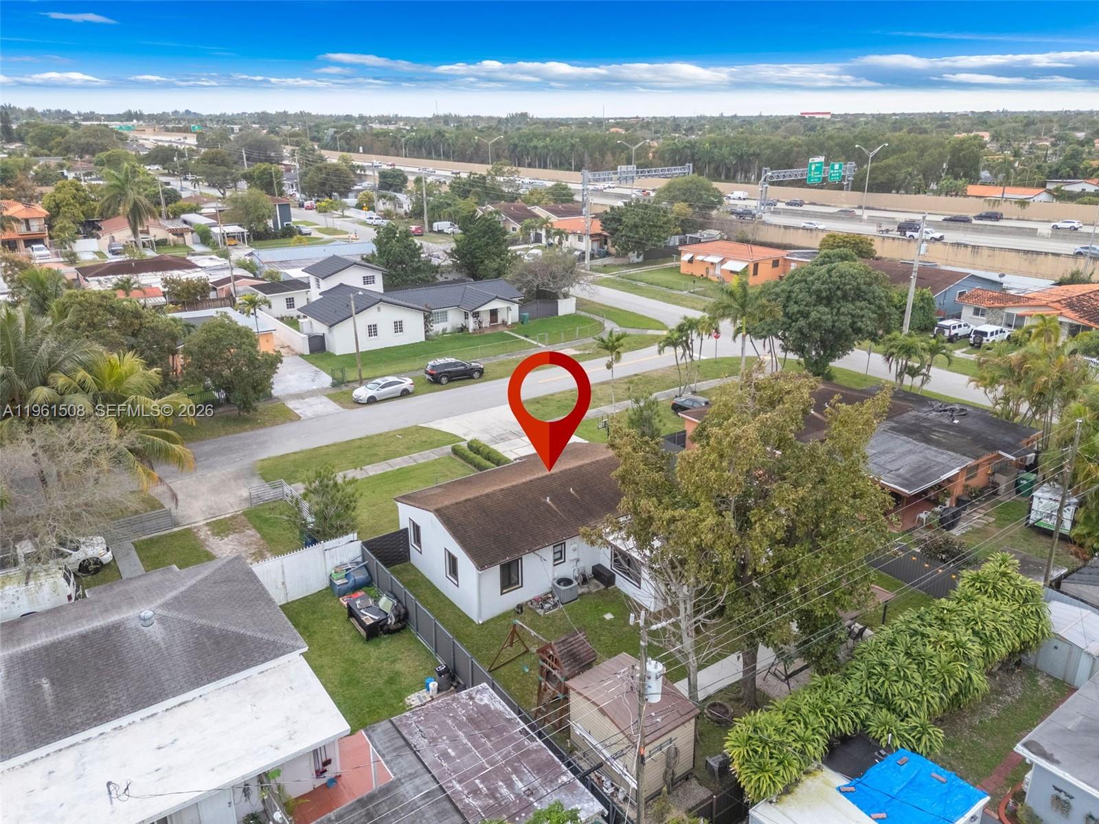 7585 Southwest 28th Street Miami, FL 33155 - Photo 27 of 28 an aerial view of a house with a swimming pool yard and mountain view in back