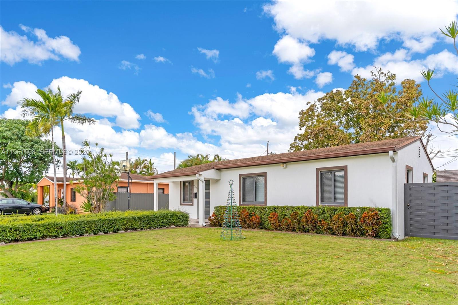 7585 Southwest 28th Street Miami, FL 33155 - Photo 3 of 28 a view of a house with a yard