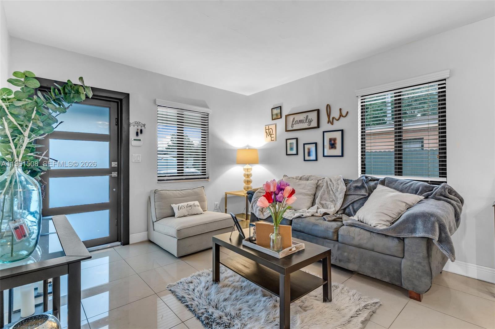 7585 Southwest 28th Street Miami, FL 33155 - Photo 5 of 28 a living room with furniture and a potted plant