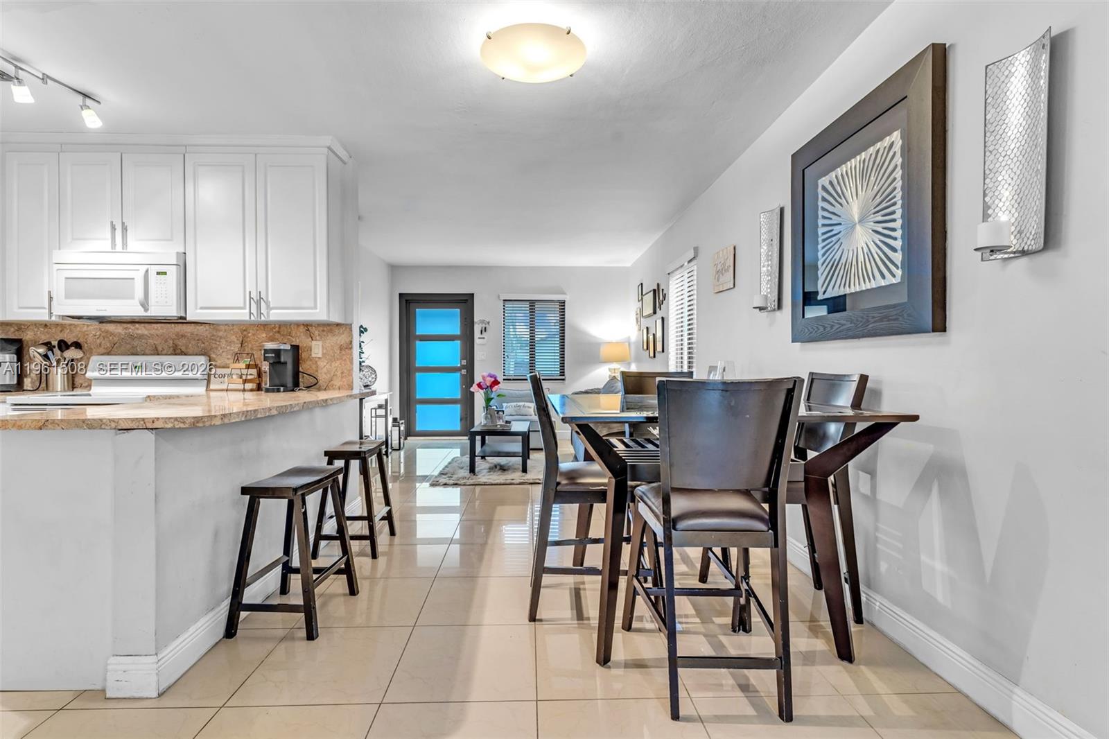 7585 Southwest 28th Street Miami, FL 33155 - Photo 8 of 28 a dining room with furniture and window