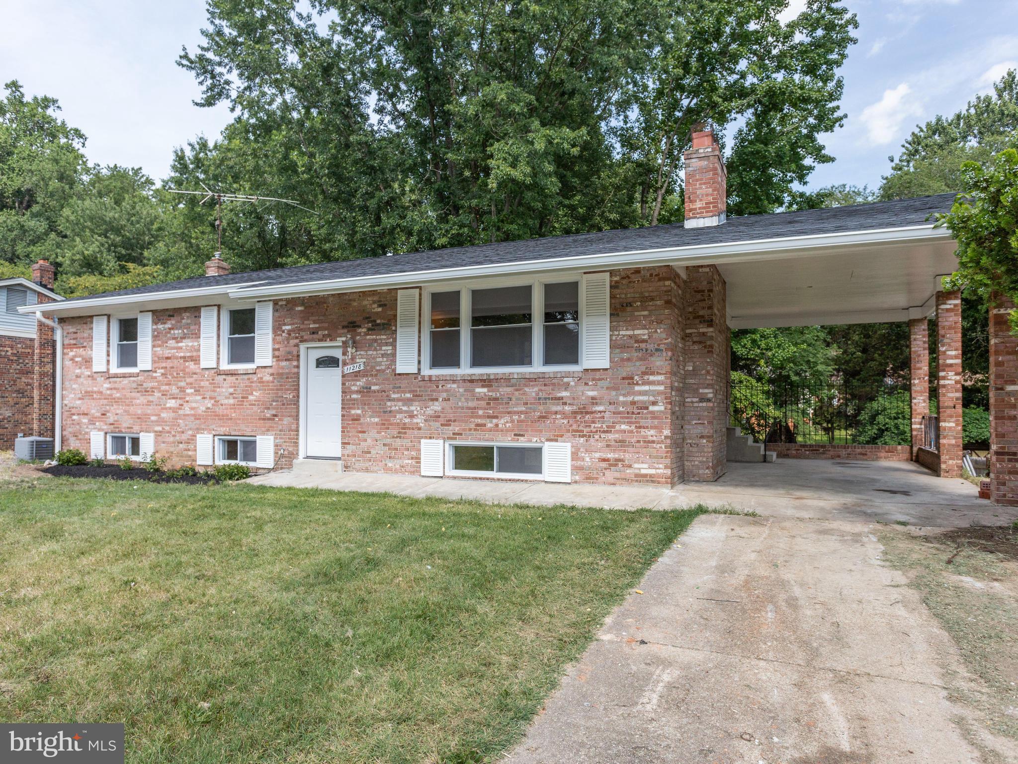 Beautiful brick front with carport, new roof