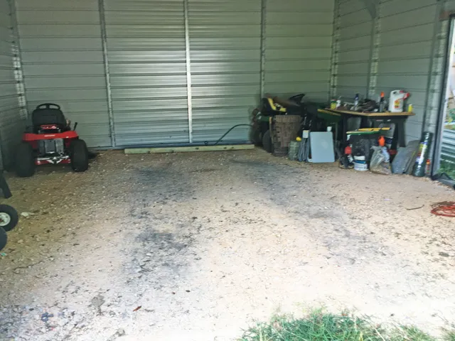 a view of a backyard with a wooden fence