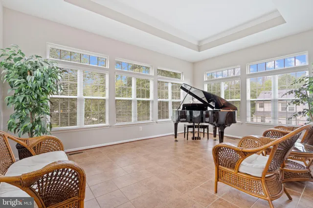 a bed sitting in a room next to a window