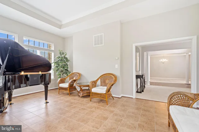 a living room with furniture window and fireplace