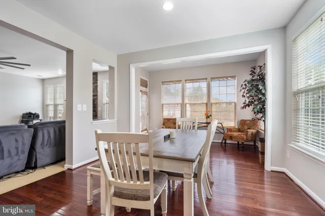 a bedroom with furniture and a large window