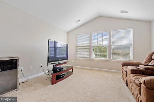a bathroom with a tub a sink and a shower