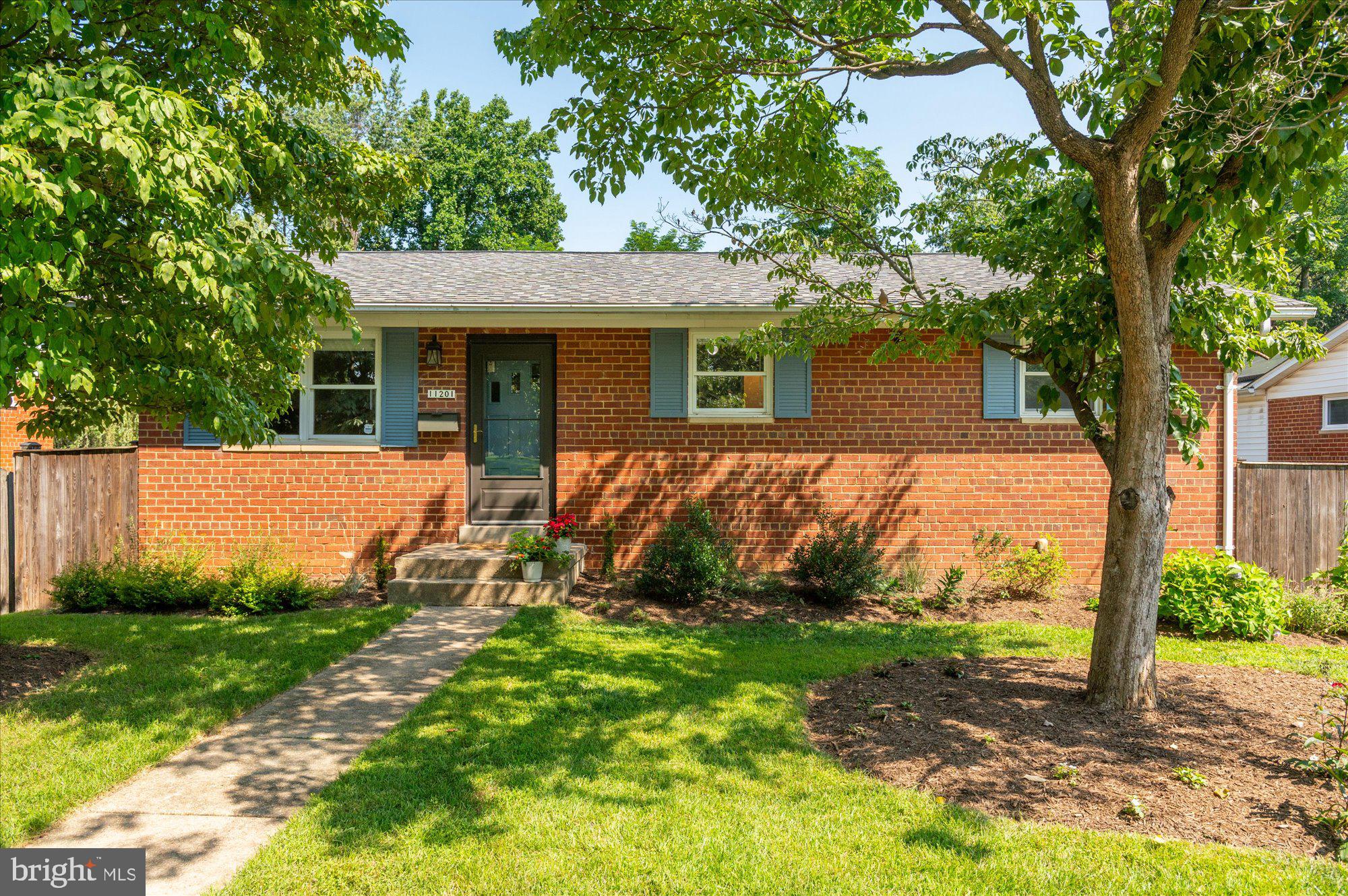 front view of a house with a yard