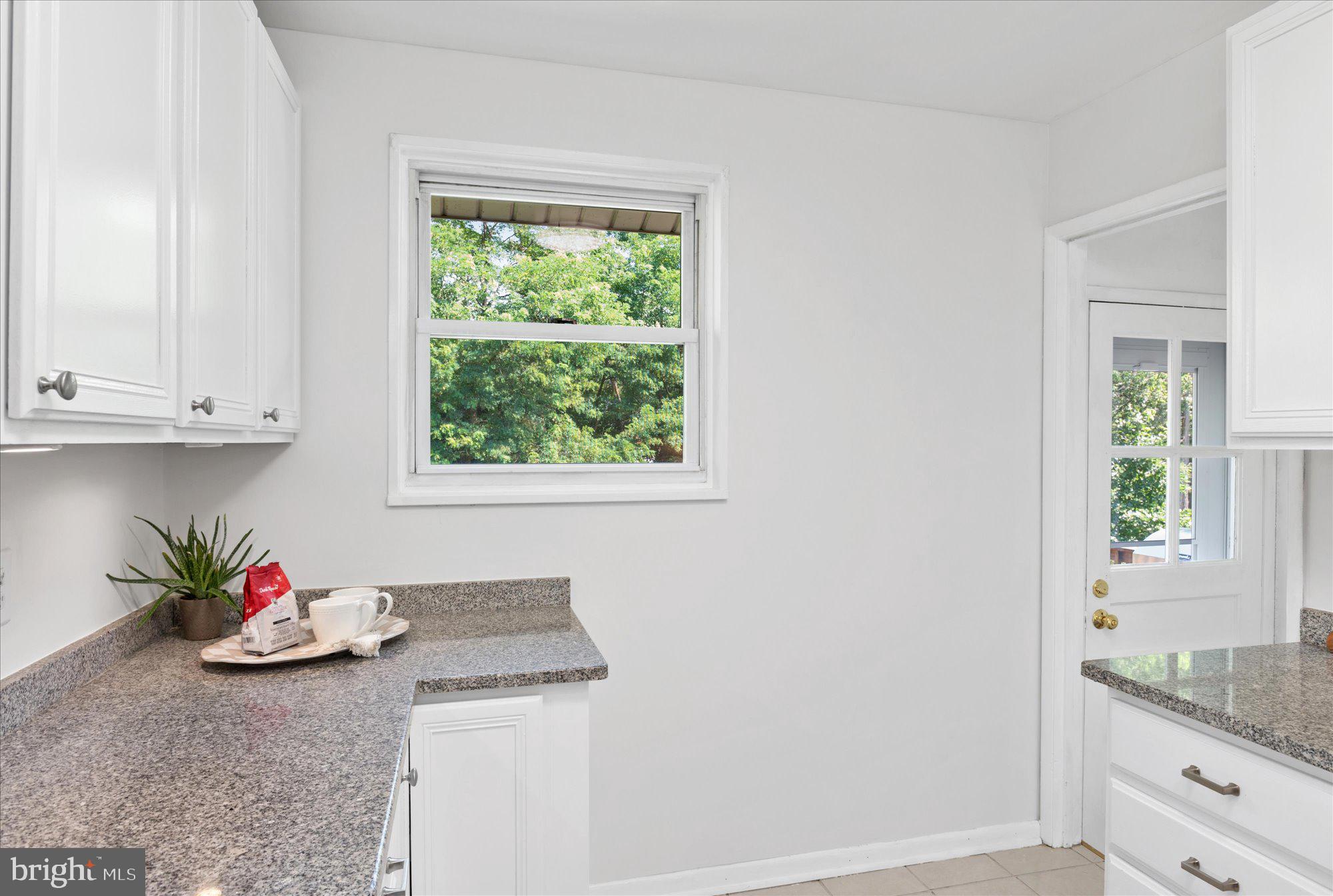 11201 Lombardy Road Silver Spring, MD 20901 - Photo 11 of 31 a kitchen with a sink cabinets and window