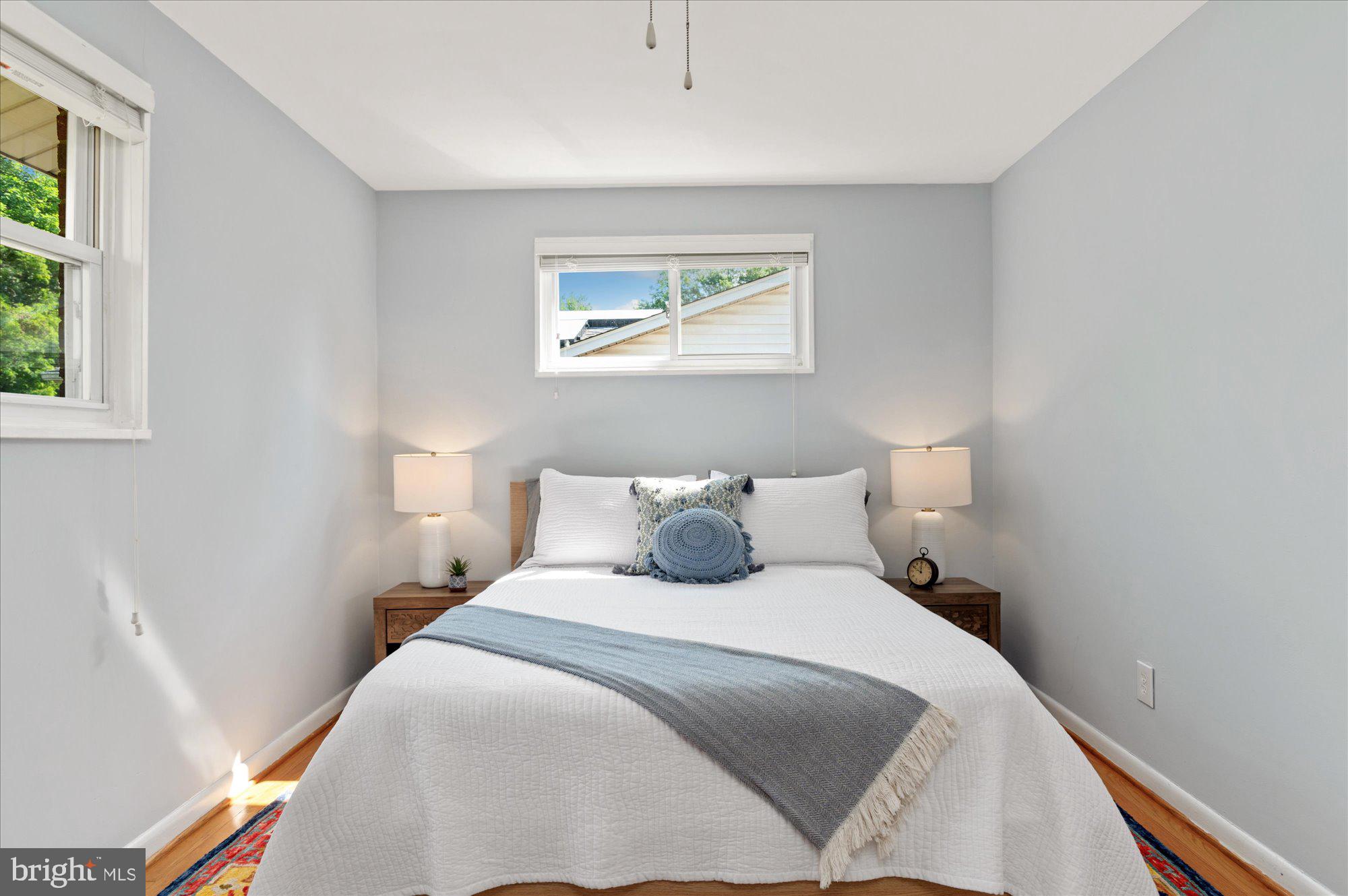 11201 Lombardy Road Silver Spring, MD 20901 - Photo 13 of 31 a bedroom with a large bed and a window