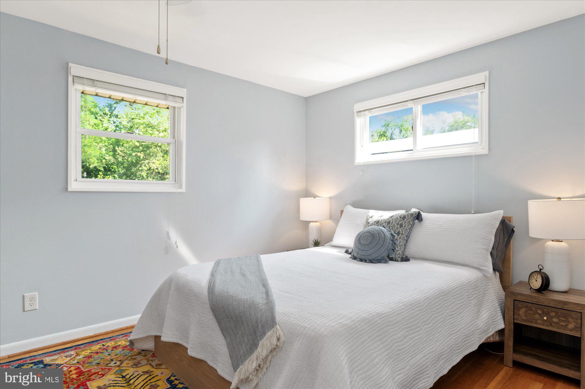 11201 Lombardy Road Silver Spring, MD 20901 - Photo 14 of 31 a bedroom with a bed and a window