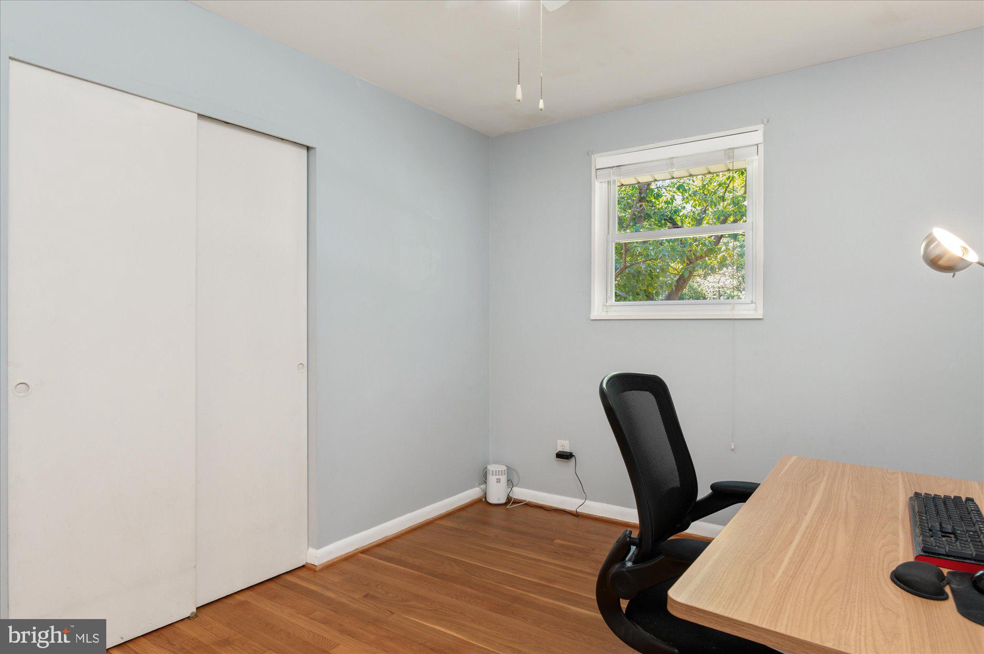 11201 Lombardy Road Silver Spring, MD 20901 - Photo 18 of 31 a view of a workspace with furniture and a window