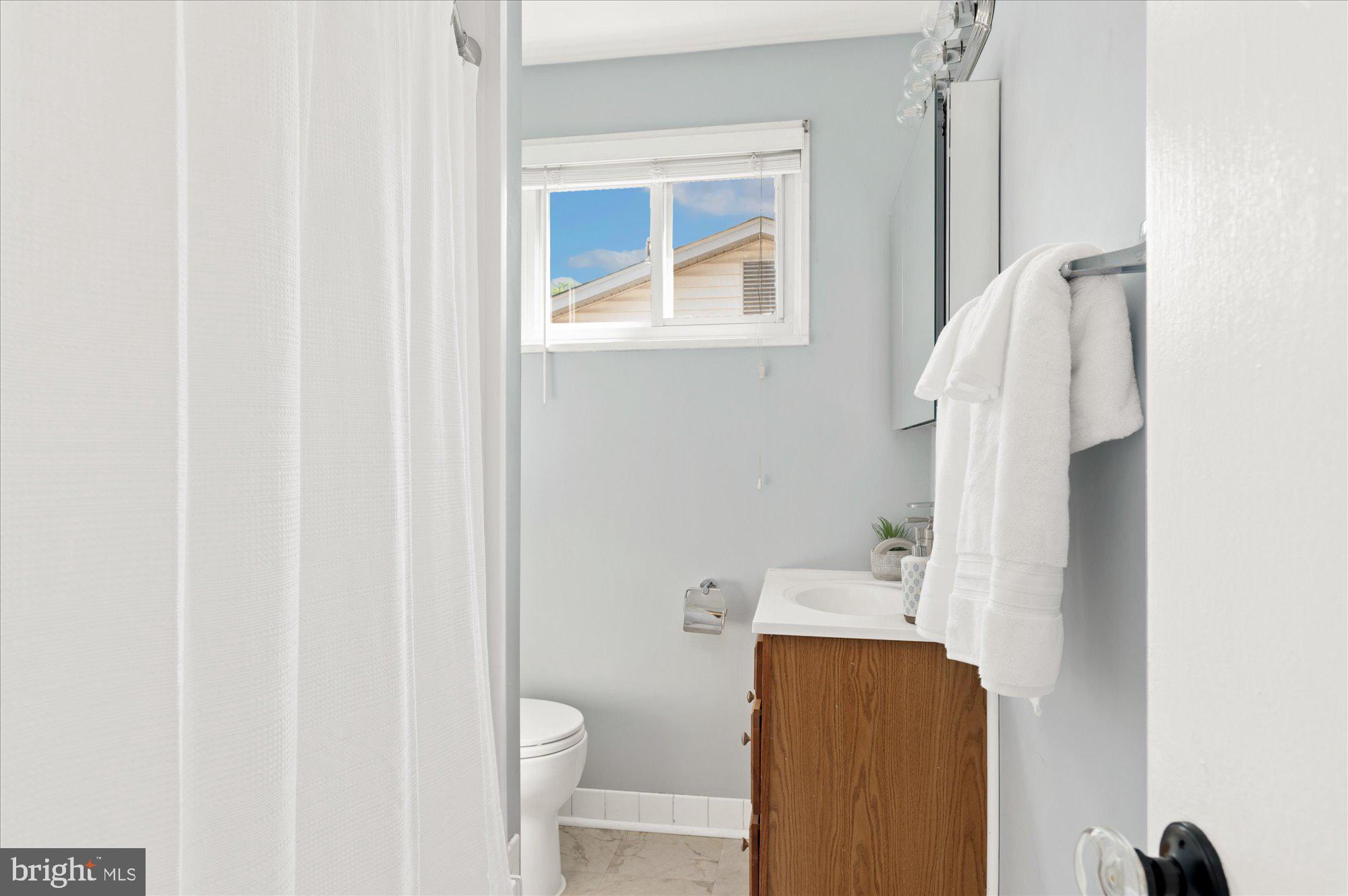 11201 Lombardy Road Silver Spring, MD 20901 - Photo 19 of 31 a bathroom with a sink and a toilet