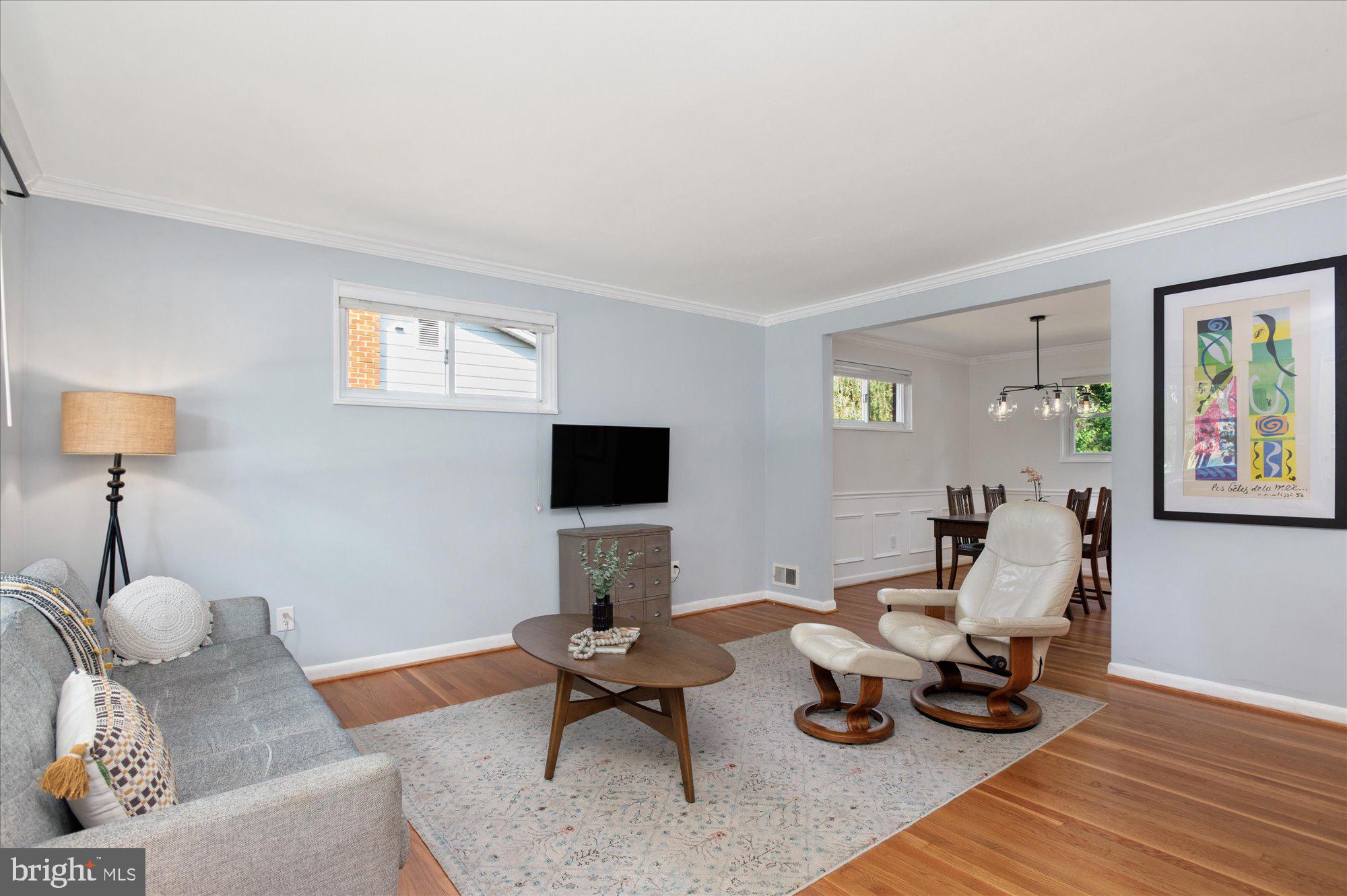 11201 Lombardy Road Silver Spring, MD 20901 - Photo 3 of 31 a living room with furniture and a flat screen tv