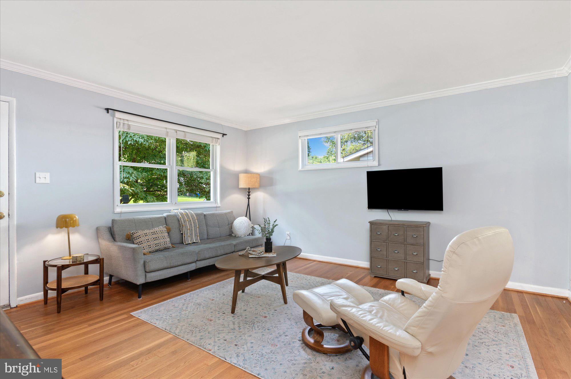 11201 Lombardy Road Silver Spring, MD 20901 - Photo 4 of 31 a living room with furniture a rug and a window
