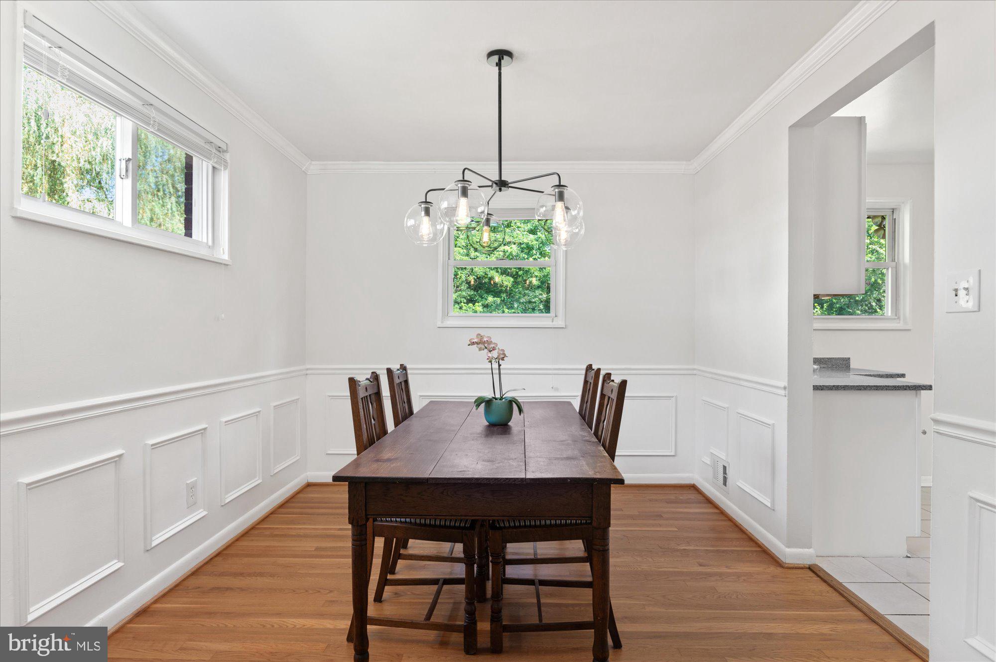 11201 Lombardy Road Silver Spring, MD 20901 - Photo 6 of 31 a view of a dining room with furniture window and wooden floor