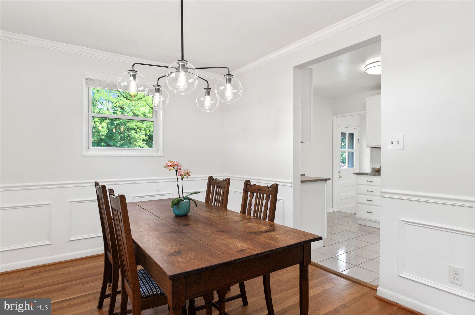 11201 Lombardy Road Silver Spring, MD 20901 - Photo 7 of 31 a view of a dining room with furniture window and wooden floor