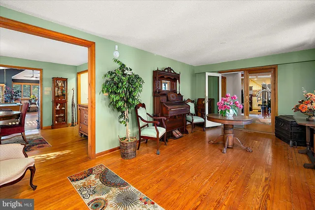 a kitchen that has a lot of cabinets and stainless steel appliances