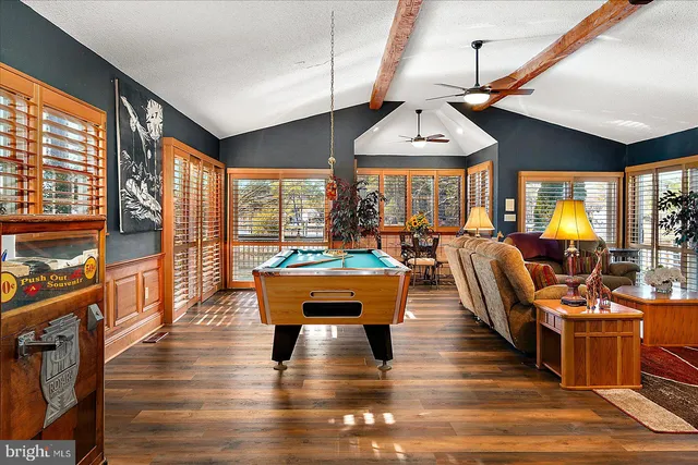 a view of a dining room with furniture and wooden floor