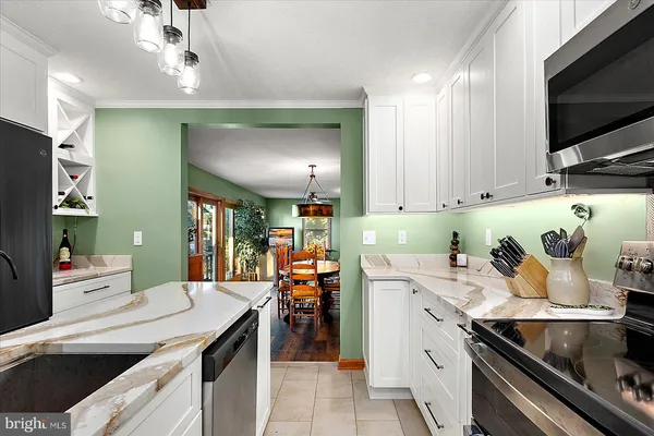 a bathroom with a sink a mirror and a shower
