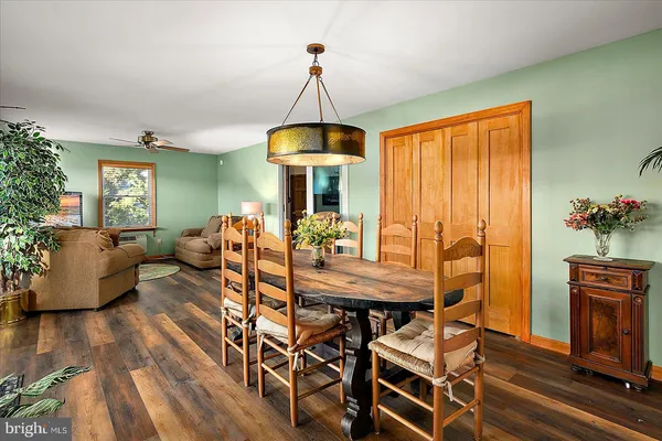 a view of a dining room with furniture window and outside view