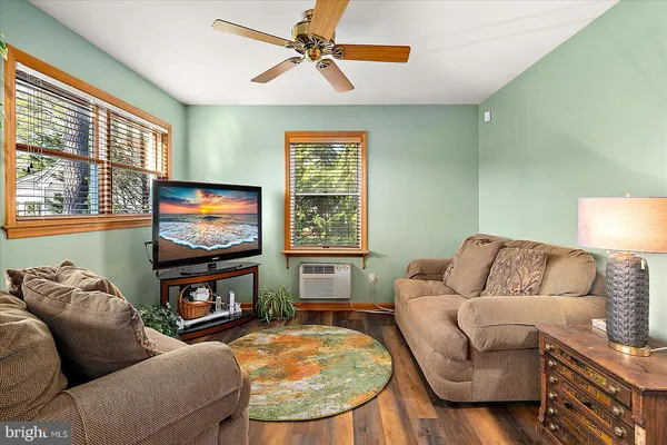 a view of a house with swimming pool and sitting area