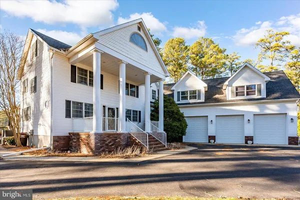 a living room with furniture a rug and a wooden floor