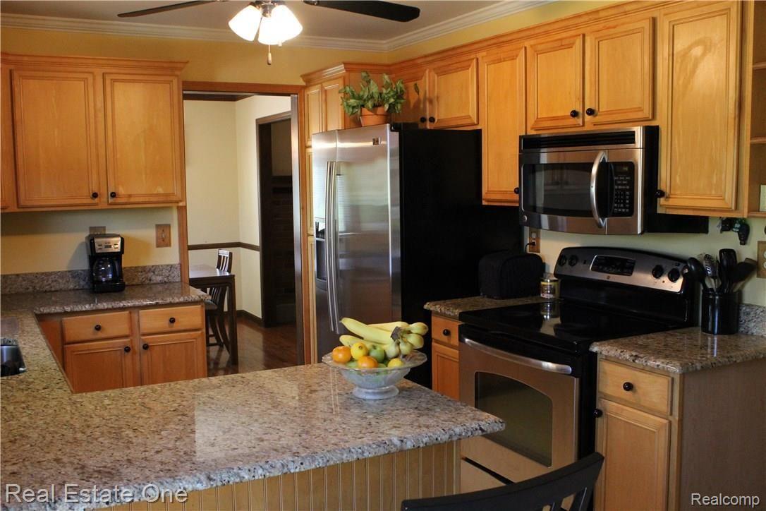 6474 Byron Road Howell, MI 48855 - Photo 31 of 62 KITCHEN WITH PLENTY OF COUNTER SPACE AND CABINETS