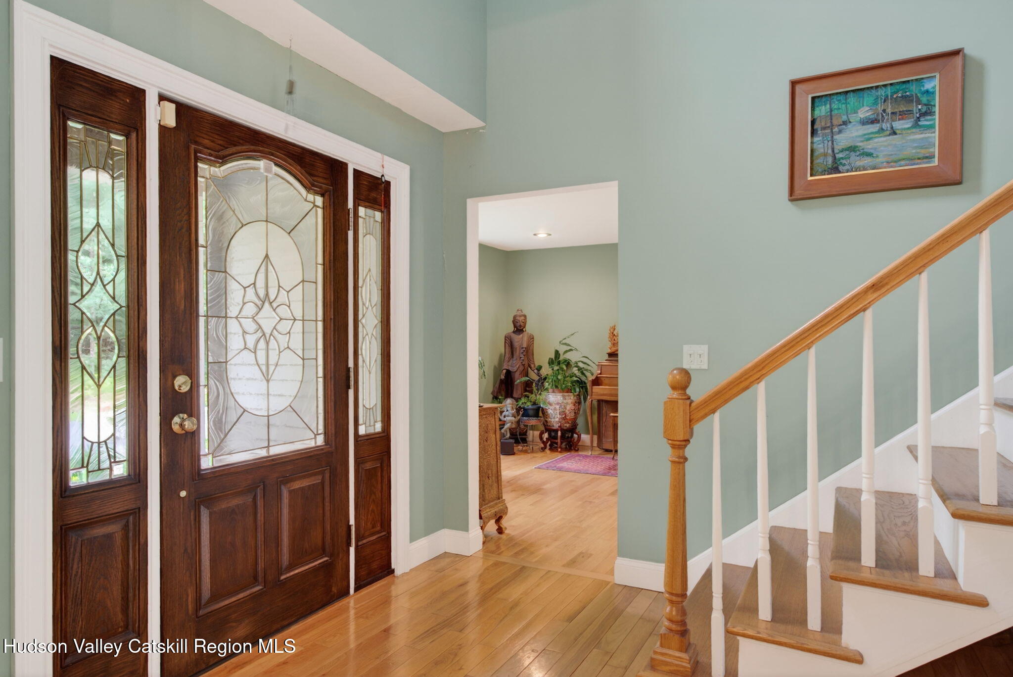 189 Bush Road Stone Ridge, NY 12484 - Photo 7 of 60 a view of an entryway with wooden floor and windows
