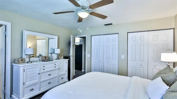 a bedroom with a bed and a dresser