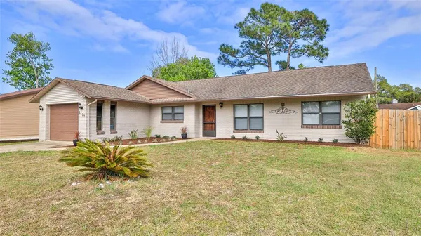 a house view with a garden space